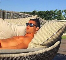 Cristiano Ronaldo Sunbathes In Near Nude Trunks