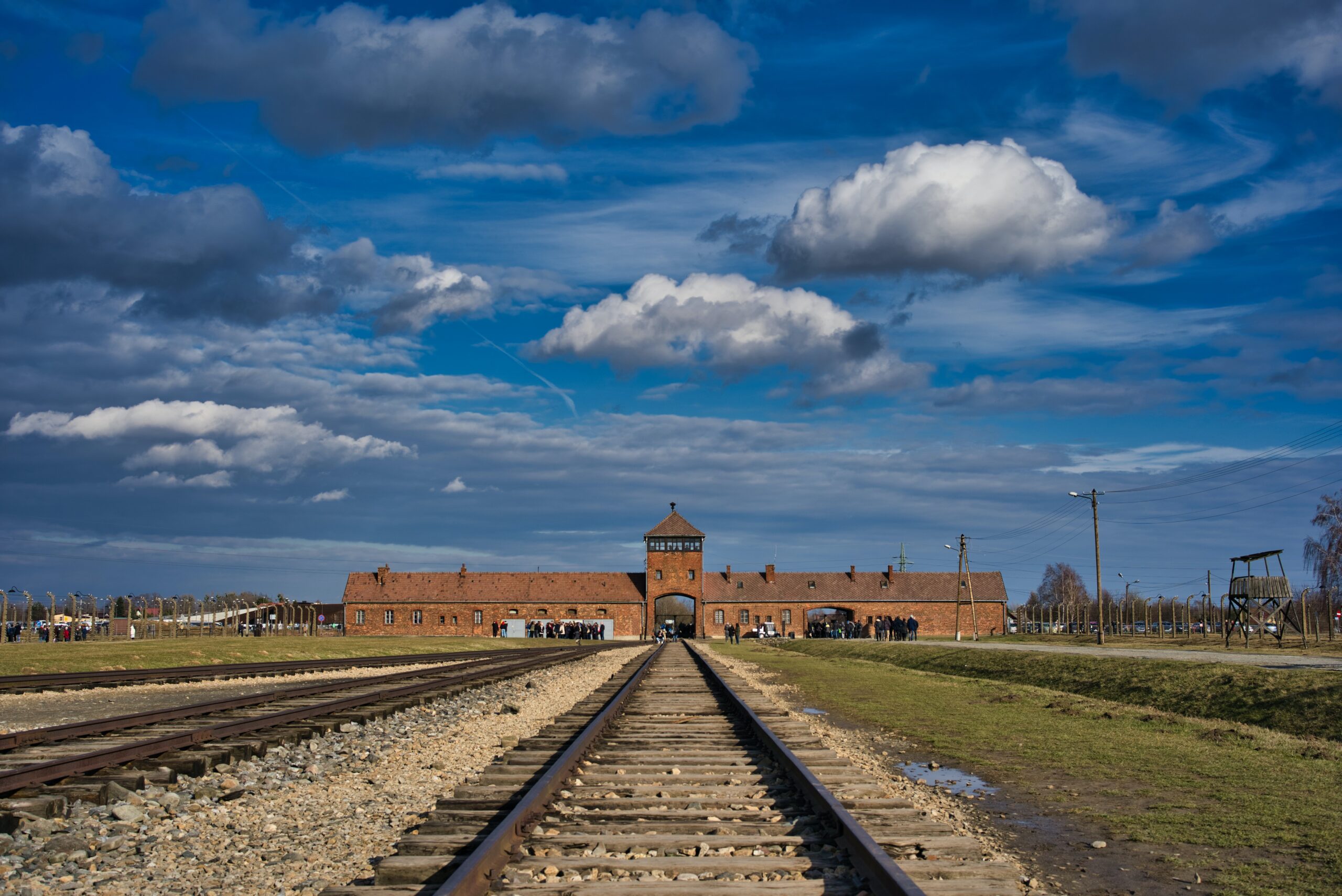 TRAVEL: Lessons From Auschwitz 1 brown concrete building under blue sky during daytime