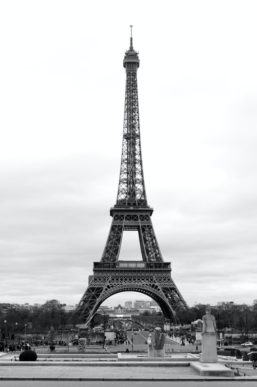 eiffel tower against cloudy sky