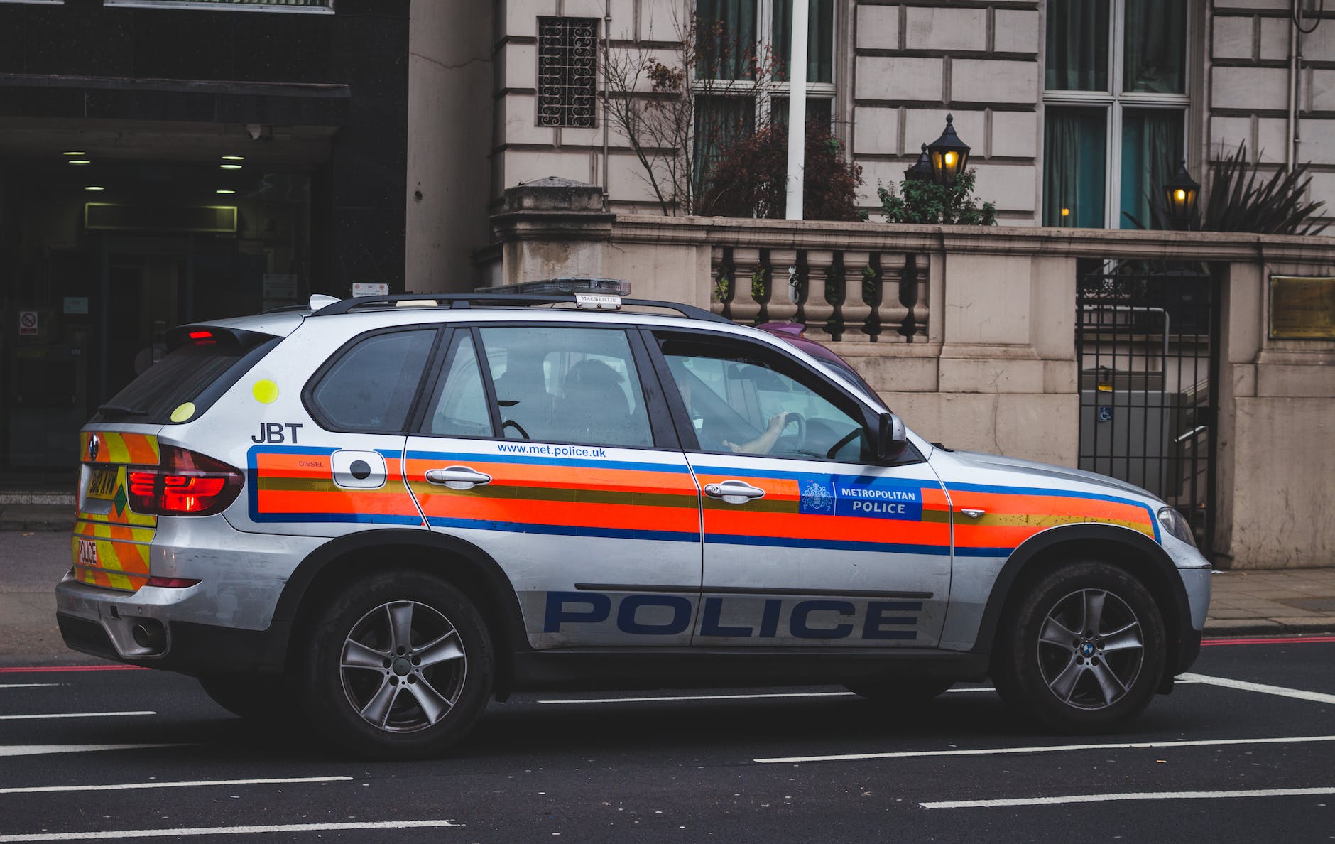 police car passing by road