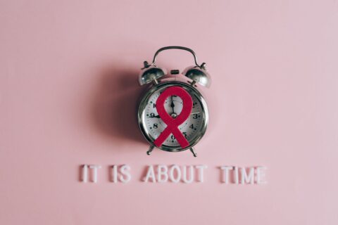 a red ribbon on an alarm clock